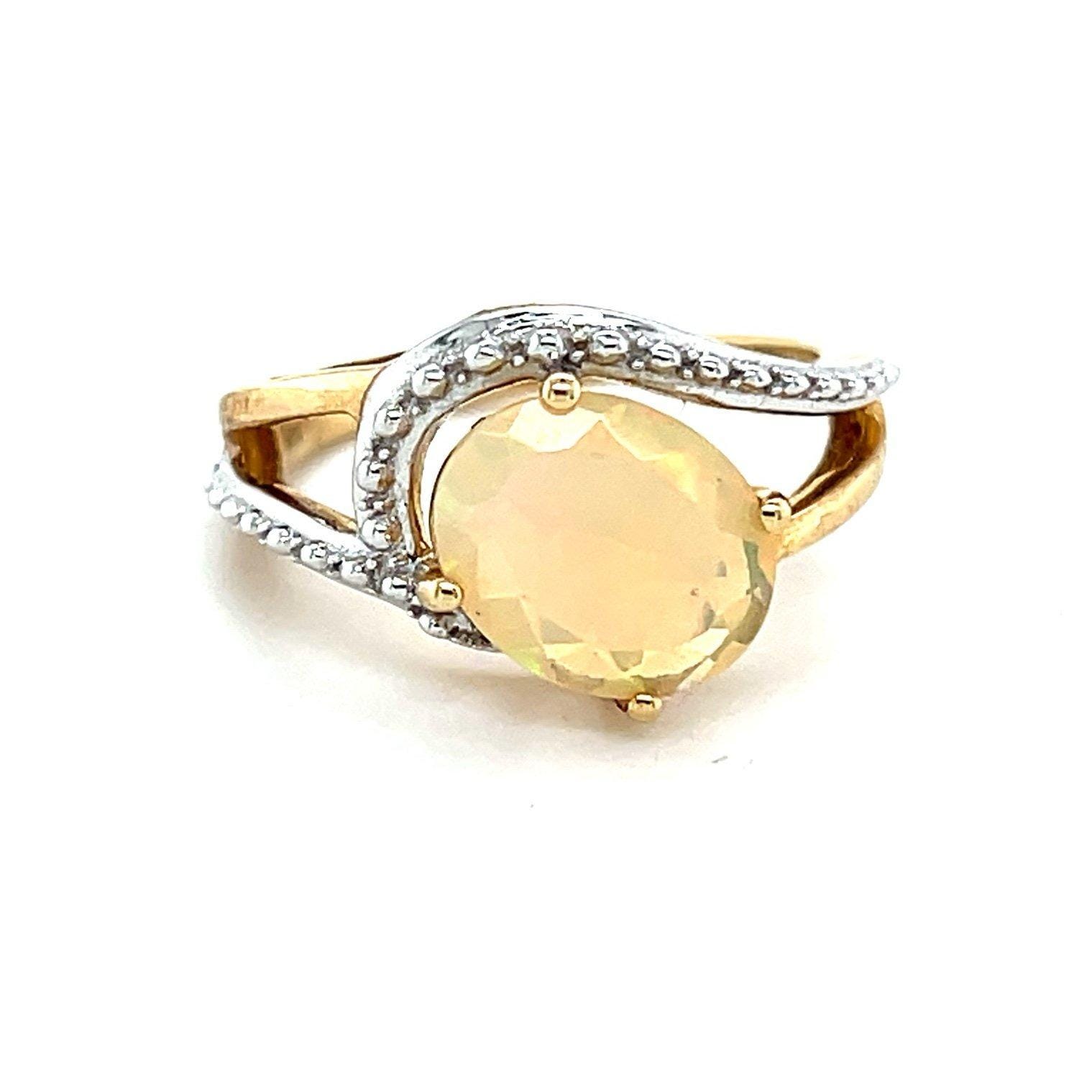 10K Oval Shaped Opal/Diamonds Ring